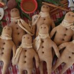 Handmade primitive gingerbread man ornament, rustic farmhouse Christmas décor with grungy finish, stitched details, and button accent