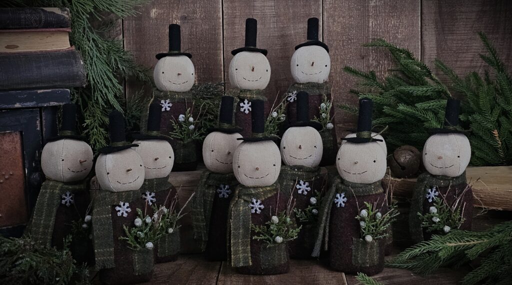 Handmade primitive wool snowman shelf sitter, rustic farmhouse Christmas décor with scarf, stovepipe hat, and snowflake detail
