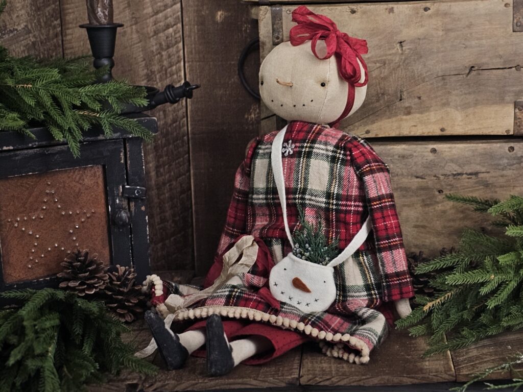 Handmade primitive snowman doll named Merry, rustic farmhouse Christmas décor crafted from vintage fabrics