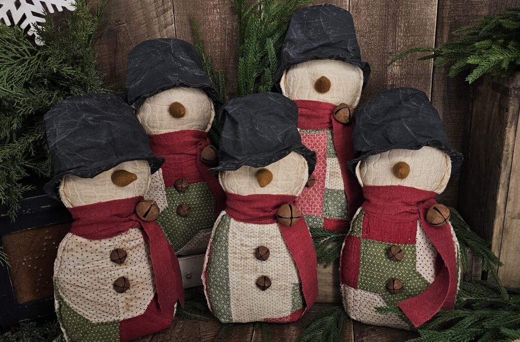 Handmade primitive quilted snowman crafted from a repurposed vintage patchwork quilt, rustic farmhouse Christmas décor with wool scarf and carrot nose