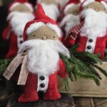 Handmade primitive folk art Santa doll, rustic farmhouse Christmas décor with wool beard, red coat, and jingle bell accents