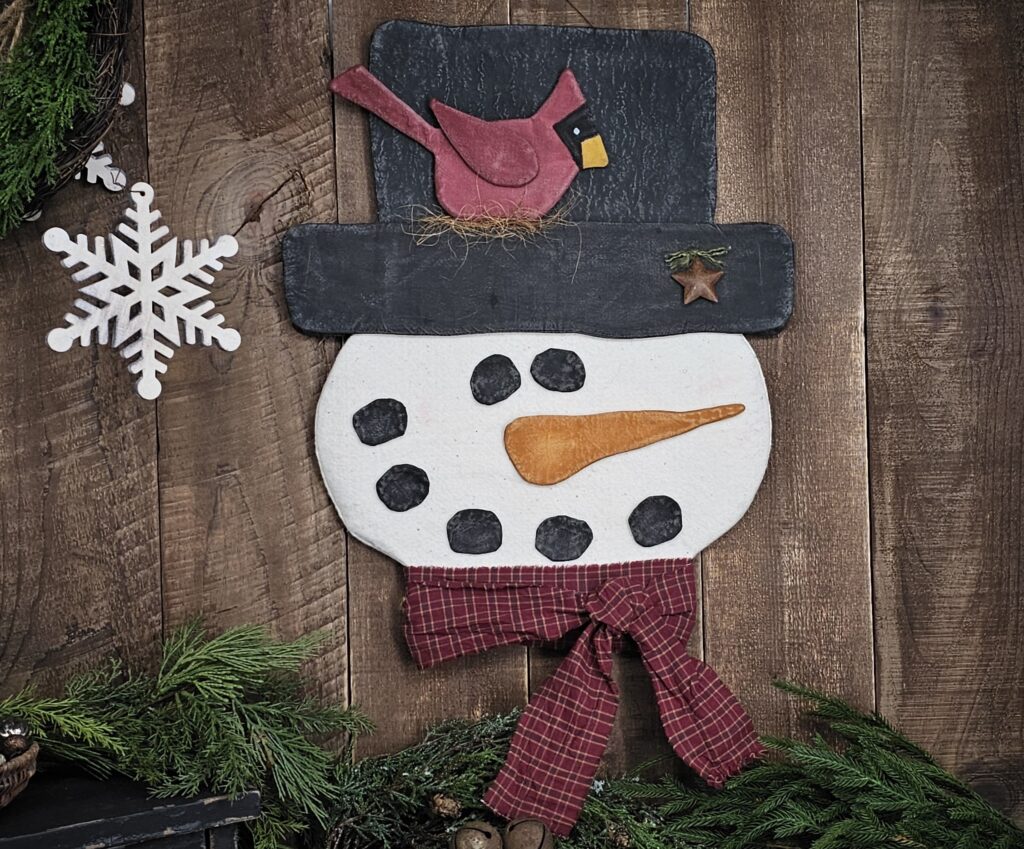 Handmade primitive snowman door hanger, rustic farmhouse winter holiday décor with plaid scarf, muslin hat, and rusty star accent