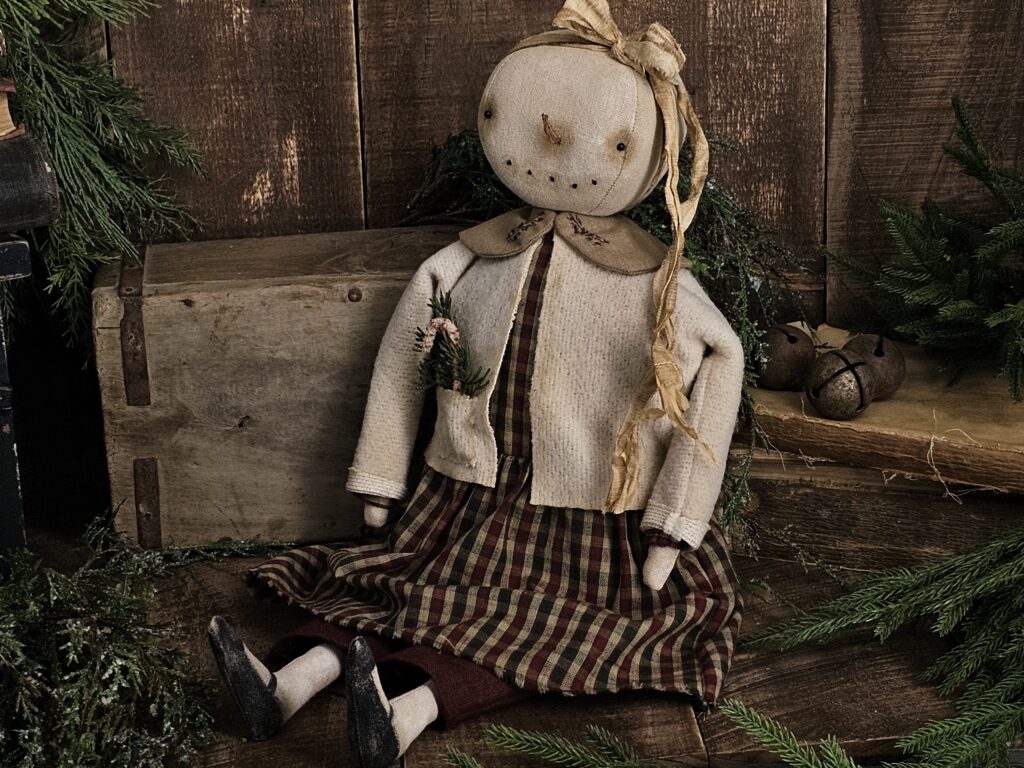 Handmade primitive winter snowman doll, rustic farmhouse Christmas décor with plaid dress, vintage trim, and carrot nose