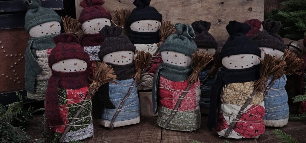 Handmade primitive quilted snowman shelf sitter, rustic farmhouse Christmas décor with antique quilt body, wool hat, and twig nose