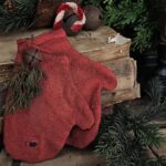 Handmade primitive Christmas mittens crafted from vintage red cotton fabric, rustic farmhouse holiday décor with jingle bell and candy cane accent