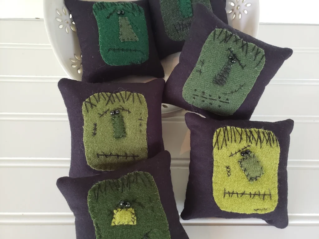Rustic Frankenstein bowl fillers in assorted wool textures for Halloween décor