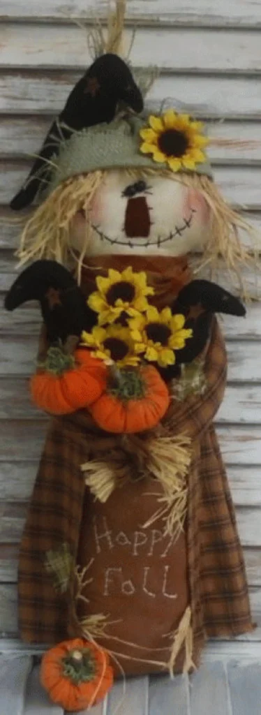 Primitive Fall Harvest Scarecrow sewing pattern with pumpkins and fall goodies