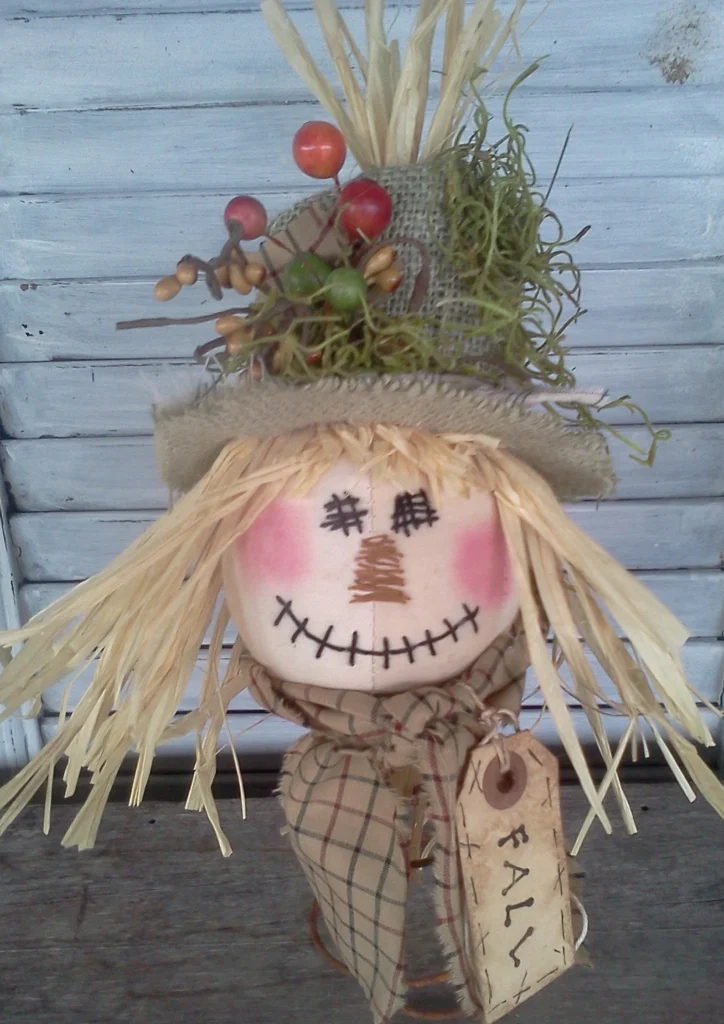 Primitive scarecrow nodder sewing pattern with stitched face and rustic fall details