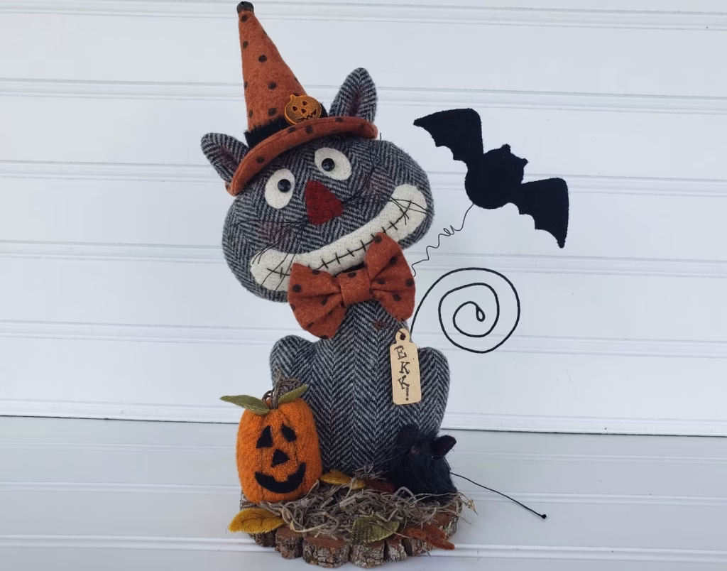 Create a whimsical primitive Halloween cat with this wool applique PDF pattern. Easy DIY fall décor project for makers who love rustic folk art and handmade charm.