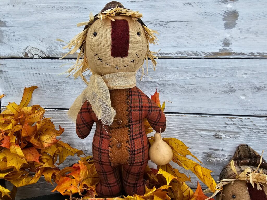 Close‑up of primitive fall plaid homespun fabric used for scarecrow body option