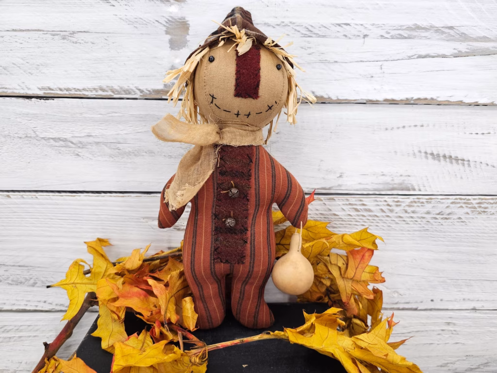 Close‑up of primitive fall ticking homespun fabric used for scarecrow body option