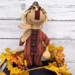 Close‑up of primitive fall ticking homespun fabric used for scarecrow body option