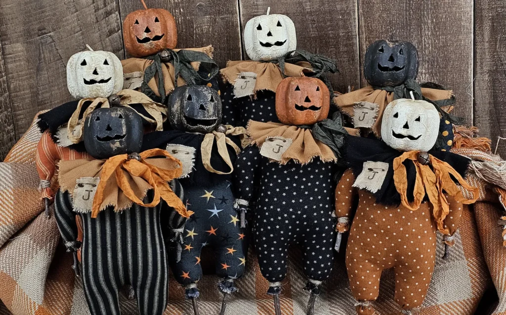 Primitive Jack O Lantern twig doll with aged paper mache pumpkin head
