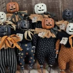 Primitive Jack O Lantern twig doll with aged paper mache pumpkin head