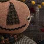 Handmade primitive pumpkin man with removable rusty Jack‑o‑lantern pin and fall accents