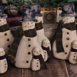 Primitive folk art snowman tuck with attached snow buddy, aged osnaburg fabric, wool scarves, and painted accents.
