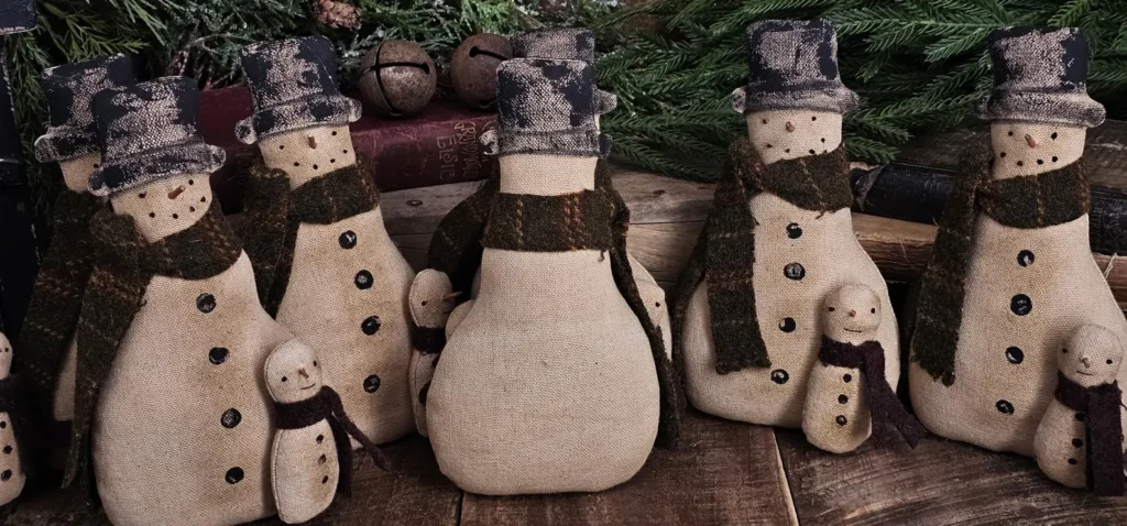Back view of primitive snowman tuck showing whitewashed osnaburg fabric and optional hanger.