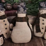Back view of primitive snowman tuck showing whitewashed osnaburg fabric and optional hanger.