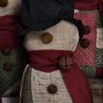 Primitive quilted snowman, Variant A, made from vintage patchwork quilt with red‑green‑cream blocks; letter A shown on photo.