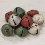 Primitive wool snowman scarf with three vintage jingle bells shown in primitive red, pine green, and antique white.
